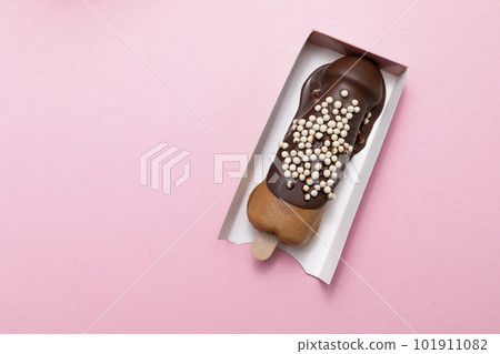 Cookie Penis Shaped Waffle On Stick Flavored With Dark Chocolate, Decorated With White Air Corn Balls In Paper Box On Pink Background. Festival Street Food. Copy Space For Text. Horizontal, Top View. Cookie Penis Shaped Waffle On Stick Flavored With Dark Chocolate, Decorated With White Air Corn Balls In Paper Box On Pink Background. Festival Street Food. Copy Space For Text. Horizontal, Top View. 101911082