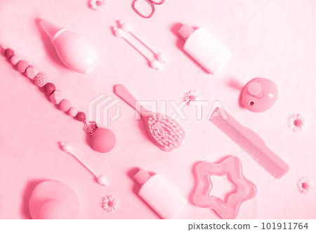 Trendy color of the year 2023, Viva Magenta. Different baby care accessories on the white background. 101911764