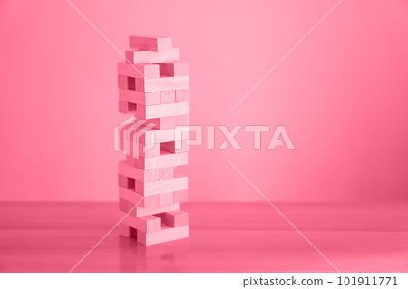 Trendy color of the year 2023 - Viva Magenta. Tower of wood blocks. Trendy color of the year 2023 - Viva Magenta. Tower of wood blocks. 101911771