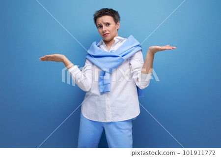 upset young woman with short haircut in stylish casual look upset young woman with short haircut in stylish casual look 101911772