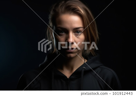 Young athletic woman in sportswear poses for the camera against a black background. Generative AI 101912443