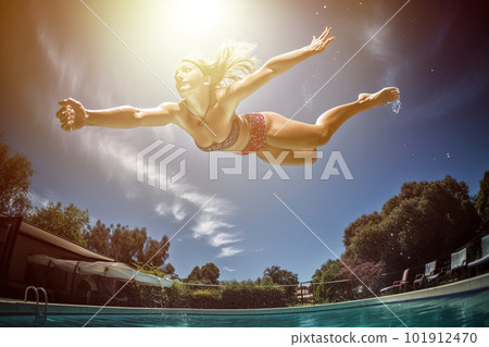 Capture the excitement of diving into a pool on a hot day. The focus of the image would be on a model mid-dive, wearing a sleek and sporty swimsuit. Generative AI 101912470