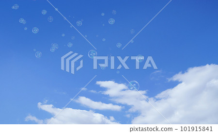 Numerous soap bubbles floating in the blue sky Numerous soap bubbles floating in the blue sky 101915841