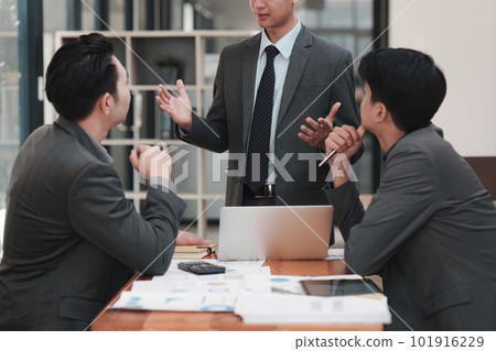 Close up of Diverse colleagues gather brainstorm discuss financial statistics at office meeting. finance, teamwork, Big data Graphs Charts concept 101916229