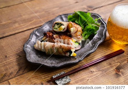 Zucchini and paprika pork belly roll 101916377