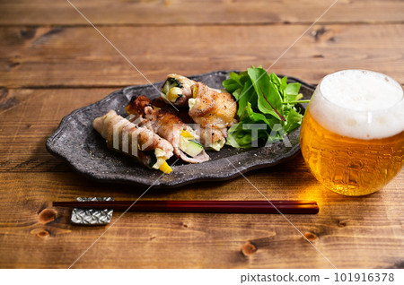 Zucchini and paprika pork belly roll 101916378