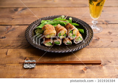 Zucchini, asparagus, sweet potato wrapped in pork belly Zucchini, asparagus, sweet potato wrapped in pork belly 101916384