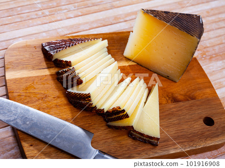 Sheep cheese with intense flavor, distinct sheep aroma, dense texture, ivory color 101916908