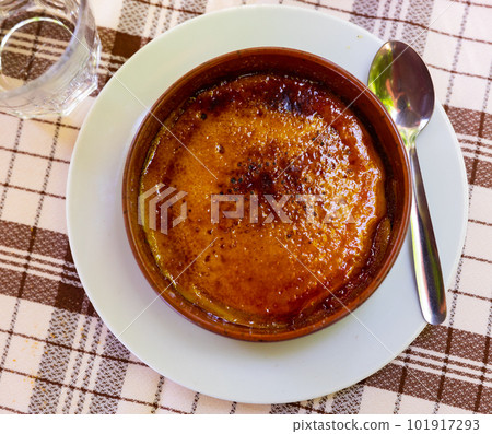 Custard dessert Catalan cream from milk and eggs with sugar crust Custard dessert Catalan cream from milk and eggs with sugar crust 101917293