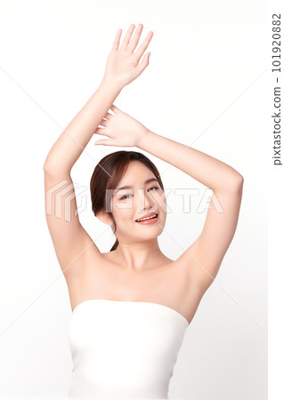 Beautiful Young Asian woman lifting hands up to show off clean and hygienic armpits or underarms on white background, Smooth armpit cleanliness and protection concept Beautiful Young Asian woman lifting hands up to show off clean and hygienic armpits or underarms on white background, Smooth armpit cleanliness and protection concept 101920882