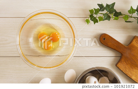 Crack the eggs into a bowl. eggs, dining table, kitchen, cooking, egg dishes, etc. 101921072