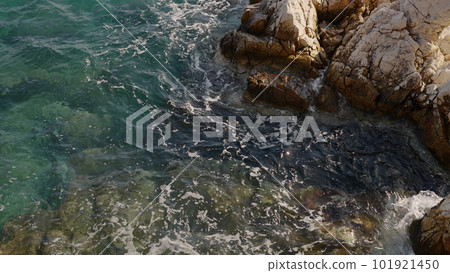 Azure waves of mediterranean sea splashing on French Riviera coast Azure waves of mediterranean sea splashing on French Riviera coast 101921450