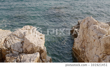 Azure waves of mediterranean sea splashing on French Riviera coast Azure waves of mediterranean sea splashing on French Riviera coast 101921451