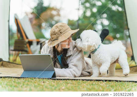 Asian female camper doing camping glamping in autumn winter campsite 101922265