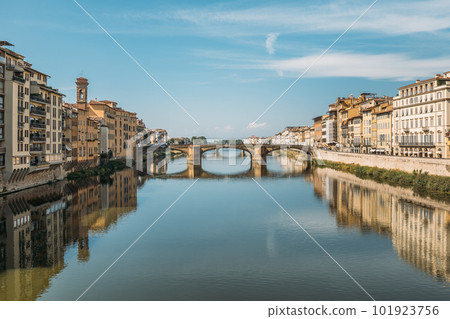 Gorgeous view of an old stone bridge across a river in Italy on a sunny warm summer evening on a blue sky. The concept of historical important infrastructural structures in Europe. Copyspace Gorgeous view of an old stone bridge across a river in Italy on a sunny warm summer evening on a blue sky. The concept of historical important infrastructural structures in Europe. Copyspace 101923756