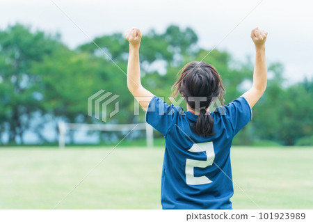 A soccer player woman rejoicing after winning futsal soccer on a soccer field 101923989