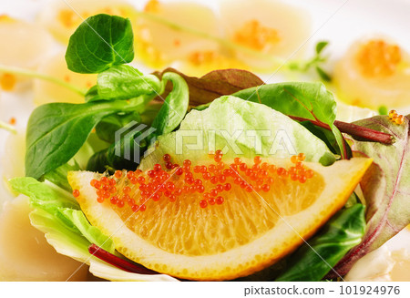 fresh scallops with red caviar on plate fresh scallops with red caviar on plate 101924976