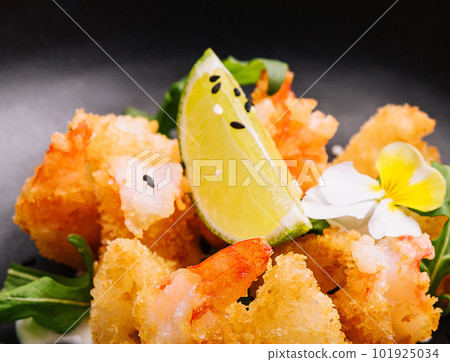fried crispy shrimp on black plate` fried crispy shrimp on black plate` 101925034