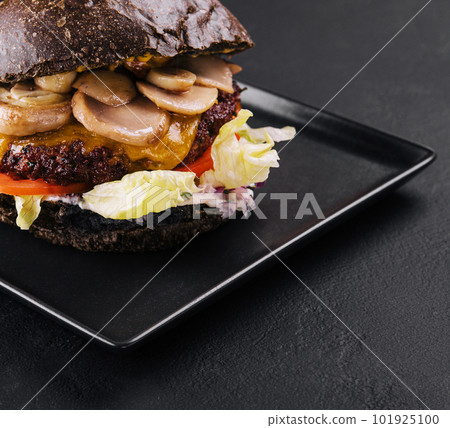 black burger with beef and mushrooms black burger with beef and mushrooms 101925100