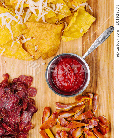 sujuk, smoked pork ears and mexican chips 101925279