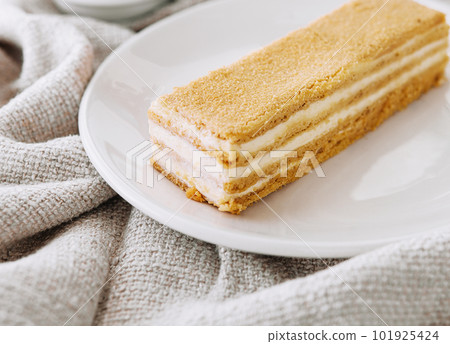 Napoleon cake slices on plate close up 101925424