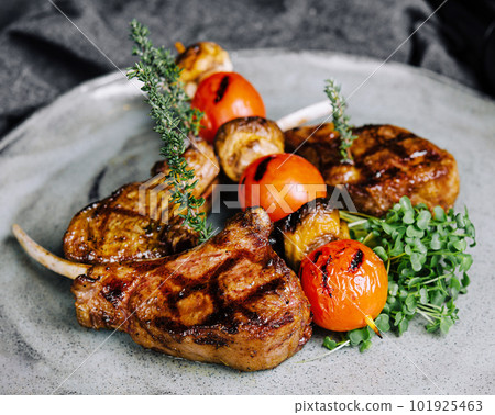 Delicious grilled pork chop on plate 101925463