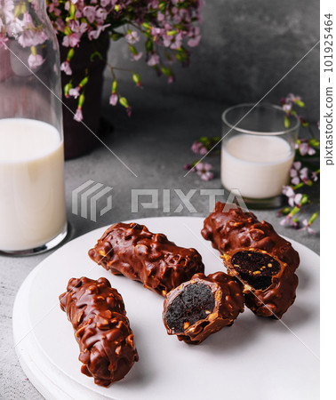 chocolate bars on plate with milk 101925464