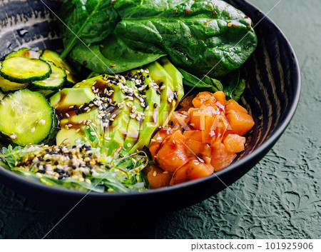 poke bowl with salmon, avocado and cucumber poke bowl with salmon, avocado and cucumber 101925906