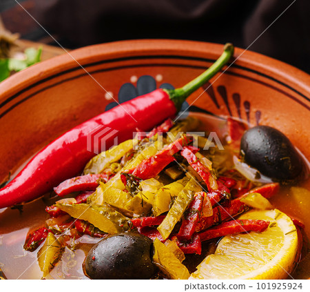 Meat Solyanka soup on a wooden board Meat Solyanka soup on a wooden board 101925924