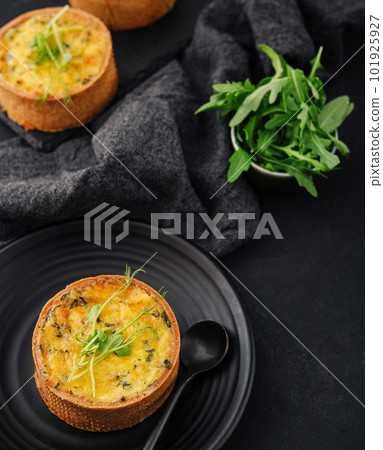 Plate of many mini bite size quiche appetizers Plate of many mini bite size quiche appetizers 101925927