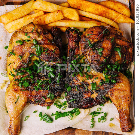 roasted chicken Piri Piri with french fries 101925950