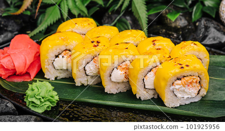 Cheese sushi rolls on the black plate Cheese sushi rolls on the black plate 101925956