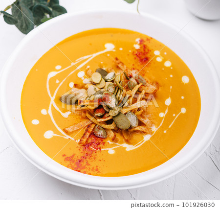 Hokkaido or butternut pumpkin soup with curry and seeds Hokkaido or butternut pumpkin soup with curry and seeds 101926030