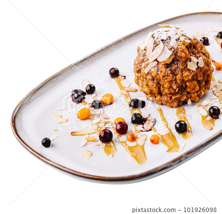 A profiterole, french choux pastry covered almond chips 101926098