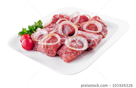Raw pork meat with onions and spices for cooking kebabs Raw pork meat with onions and spices for cooking kebabs 101926326