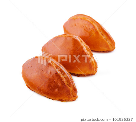 baked stuffed pies on a white plate baked stuffed pies on a white plate 101926327