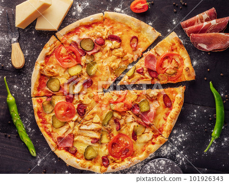 pizza with sausage, ham and chicken 101926343