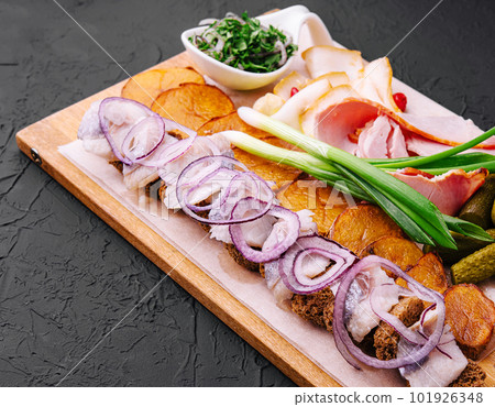 Rustic appetizer for vodka on wooden board 101926348