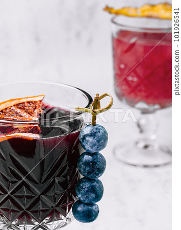 Glass of hot mulled wine with spices 101926541