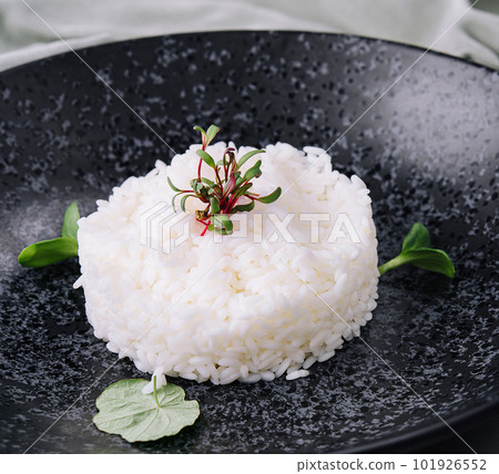 Portion of classic italian risotto on black plate Portion of classic italian risotto on black plate 101926552