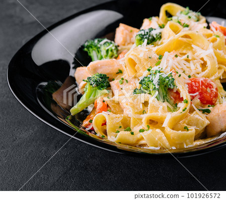 italian fettuccine alfredo pasta dish with grilled salmon and broccoli italian fettuccine alfredo pasta dish with grilled salmon and broccoli 101926572