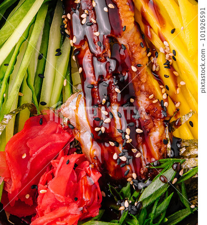 Hawaiian salmon poke bowl with cucumber, mango and pickled ginger 101926591