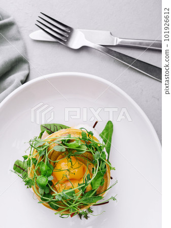 Bagel with salted salmon, spinach, avocado and soft boiled egg with liquid yolk Bagel with salted salmon, spinach, avocado and soft boiled egg with liquid yolk 101926612