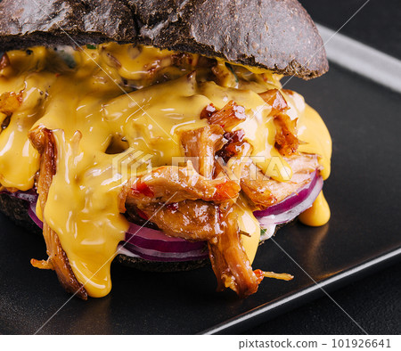 black burger with pulled pork on black black burger with pulled pork on black 101926641