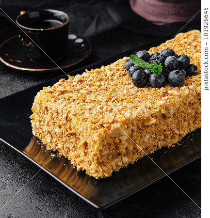 Napoleon cake decorated with blueberries and mint 101926645