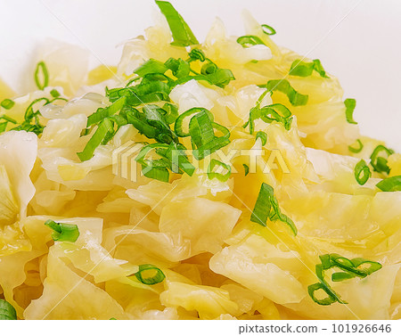 Bowl of tasty fermented cabbage on white 101926646