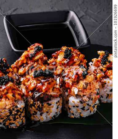 Sushi roll- gourmet fast food on black stone Sushi roll- gourmet fast food on black stone 101926699