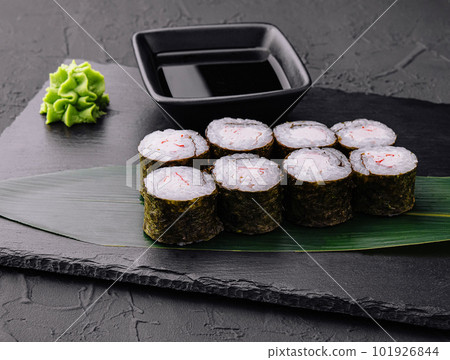 Crab stick maki sushi on black tray 101926844