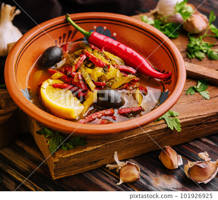 Meat Solyanka soup on a wooden board 101926925