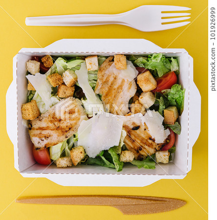 Caesar salad packed on craft box for take away Caesar salad packed on craft box for take away 101926999